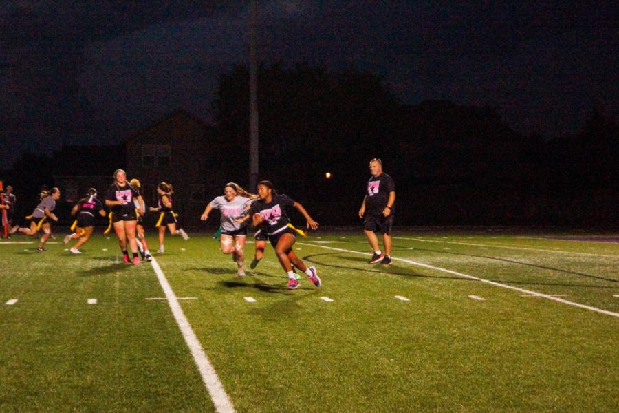 Senior Charity Monroe attempts to get a first down after quarterback Aliya Cantrell hands off the ball. 