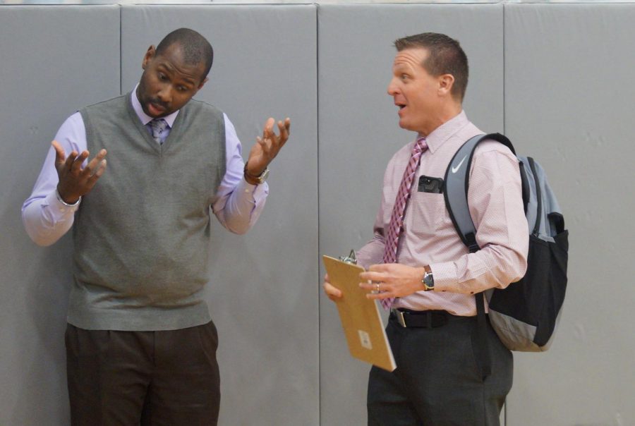 Head Coach Toure Grimes talks with assistant coach Gary Beashore before the semi-final game against Gardner. This is Grime’s second year being the Head Coach.