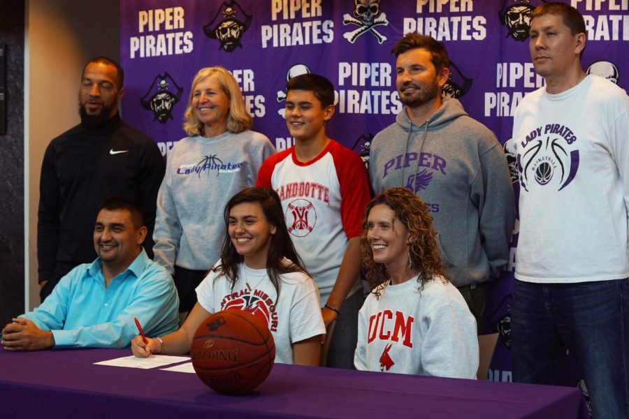 Senior Alison Vigil's family and coach her join her as she signs her letter of intent. Vigil will be a part of the Jenny's basketball team in 2020. 