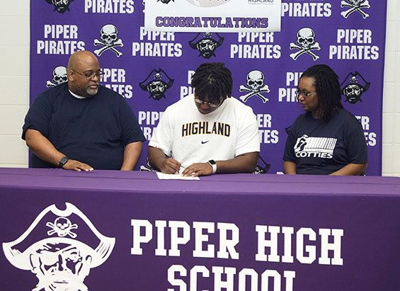 Tony Cobbs signs to Highland Community College to continue his football career. 
