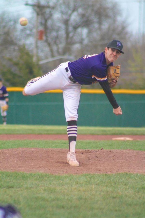 Junior Varsity player Zak Surprise pitches during a home game. 